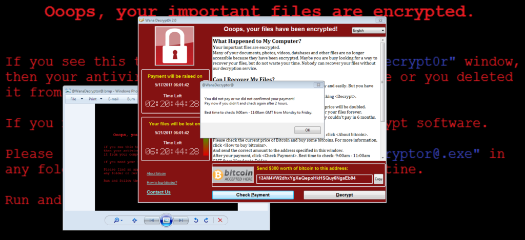 wannacry ransomware message on computer with warning message in the background